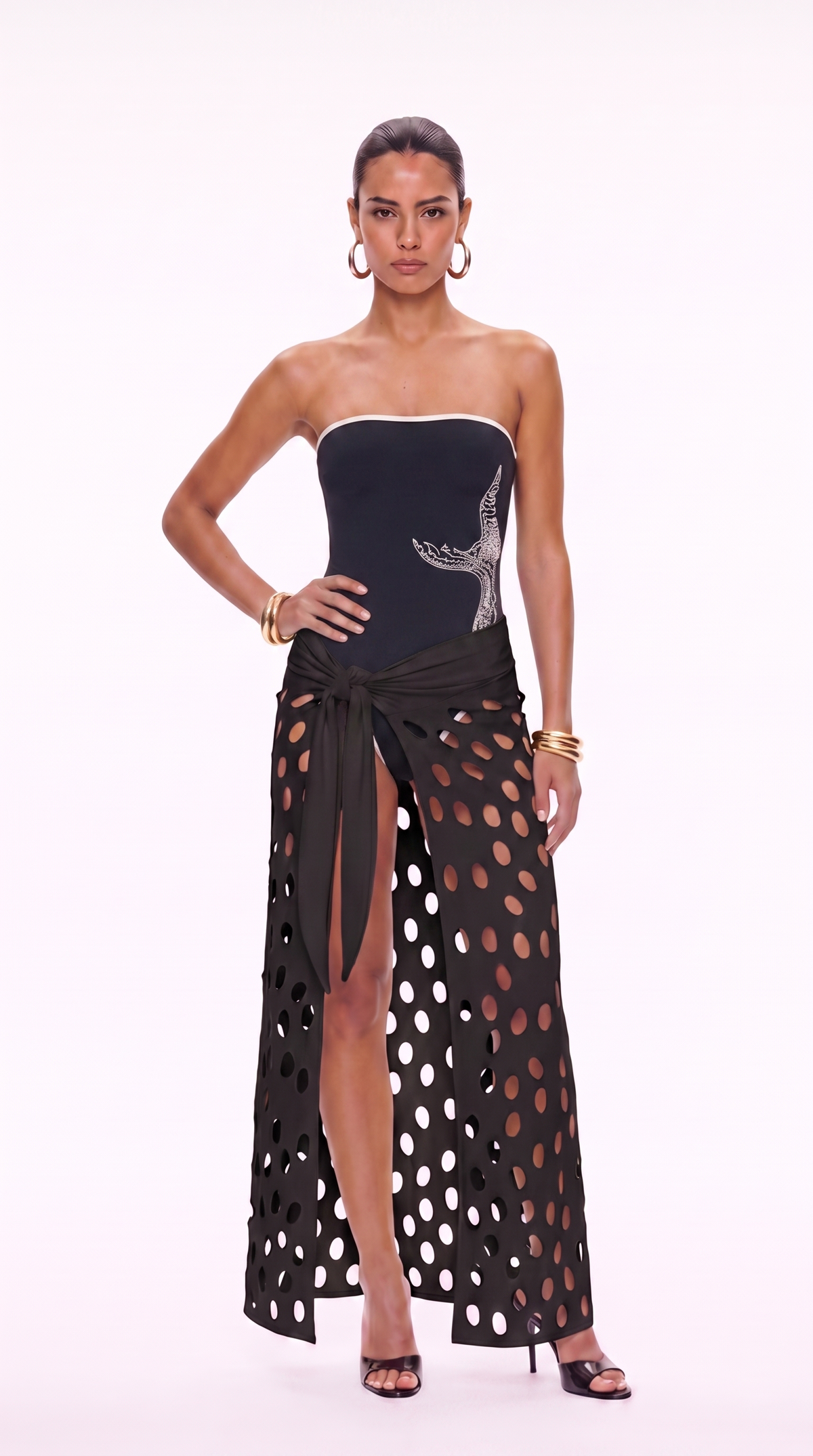 Eds black cutout maxi skirt with asymmetric oval openings and high front slit